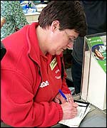 Janet signs on the dotted line!