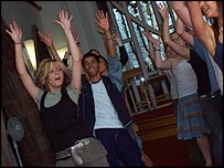 Group of kids dancing in theatre rehearsal