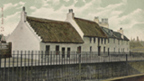Hand-coloured view of thatched cottages at Water Row in Govan.