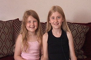 Megan and Millie's parents are foster carers. They take us on a tour of the house and show us where Millie's new bedroom will be.