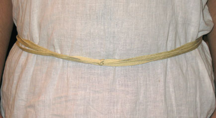 Rope tied three times around a waist