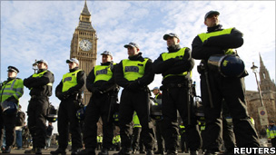 Police officers stand in Parliament Square