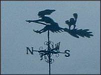 A witch weather vane