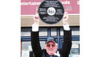 Joe Flannery holding a plaque