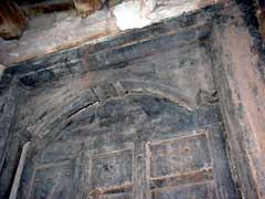 One of the door-heads under restoration