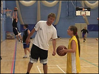 girl playing basketball