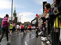 Spectators watching the London Marathon near Tower Hill