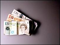 Money: a £5 note, £10 note and £20 note