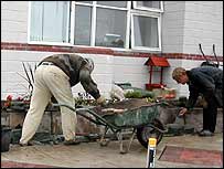 Mike and Paul start to construct the wall