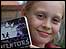 Picture: Lydia holding a copy of The Inventors: link.