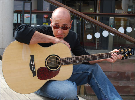 Mark Powlett with his guitar