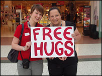Rachel and Clare offering free hugs in Telford