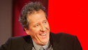 A smiling Geoffrey Rush