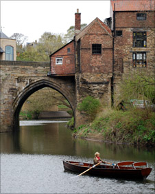 Helen Skelton rowing along teh River Wear at Durham