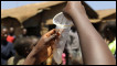 A demonstration on how to use a condom at an open-air clinic by educators on HIV/AIDS and contraceptive use in Kibera slum, Nairobi (file 2009).