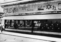 Photograph of a tailor's shop in Vienna defaced with anti-Jewish slogans by Nazi hooligans