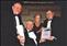Presentation to Tommy at the Employer's Forum on Disability NI Ltd Awards, 2004, in City Hall Belfast. PROTEUS was nominated for the 'Participation Award', which was won against contenders such as the main banks, government agencies and other companies across Northern Ireland.<BR />The photo shows (back row) Pat Donnelly Chief Executive, Alice Quinn, Chair of PROTEUS and Tommy. Seated (centre) is Phil Friend, keynote speaker on disability in the workplace.