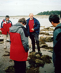 Tom McErlean (centre) explains stone fish trap design
