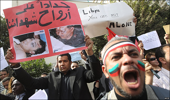Protesters in Cairo shout slogans against Libyan leader Muammar Gaddafi, 22 Feb 11