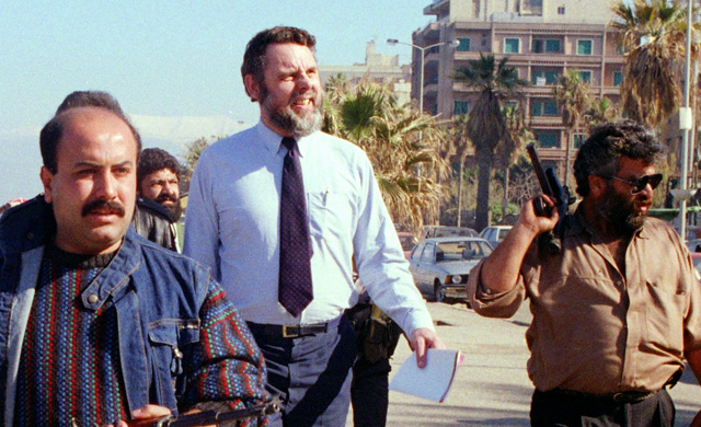 Special Envoy Terry Waite (in the white shirt) in Beirut surrounded by heavily armed bodyguards shortly before his capture. (Photo: AFP/Getty Images)