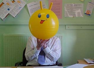 A Man with a Spacehopper for a head