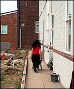 Gail wheeling a barrow