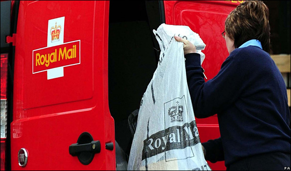 Royal Mail worker collecting post