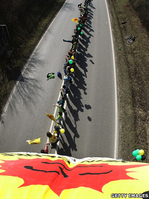 Protesters in Germany hold hands in a demonstration against nuclear power