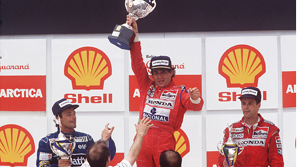 Ayrton Senna on the podium after winning the 1991 Brazilian Grand Prix, flanked by Riccardo Patrese and Gerhard Berger