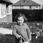 Beryl standing outside the bungalow that was later bombed.