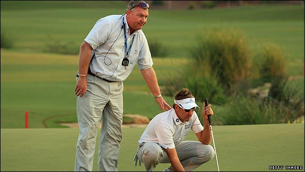 Tournament referee Andy McFee (left) consoles Ian Poulter.
