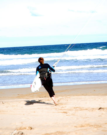 An out-of-sight kite takes the strain as this competitor races in to the water for a practise session.