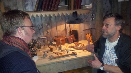 Adam with Dr. Tom Sharpe in the Museum's reconstruction of Scott's hut