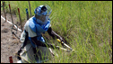 a Southern Sudanese woman deminer clears grass and soil around a suspected landmine in a minefield in Bungu in Central Equatoria state, south Sudan.