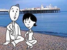 Michal and Helen sitting on the beach