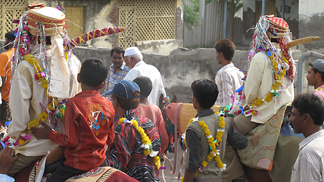 Wedding procession with men on horseback