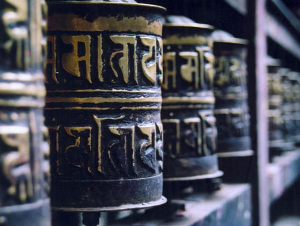 Wooden prayer wheels engraved with mantras