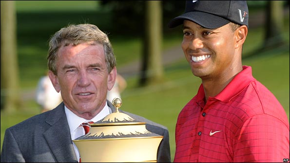 PGA Tour commissioner Tim Finchem poses with Tiger Woods after his win in the Bridgestone Invitational