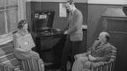 A.S. Hornby (centre) playing a series for beginners to his colleagues N. Everill (left) and the 'English by Radio' editor René Quinault (right).