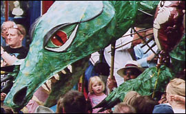 A dragon leers over the crowds 