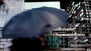 A woman passes the Department of Finance in Dublin