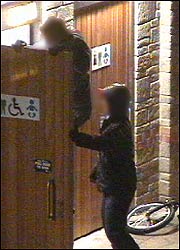 Younths trying to break into a toilet