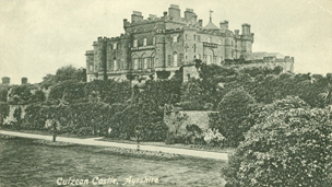 Black and white view over formal gardens to Culzean Castle.