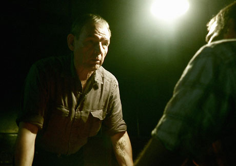 A police officer played by David Schofield interviews Sean (Joseph Millson) about events at Devil's Bridge. Photo © Dogs Of Annwn Ltd.