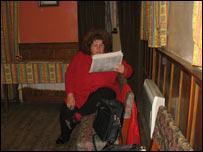 Woman reading newspaper