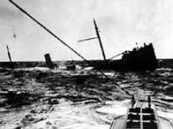 A black and white photograph of British ship sinking after a U-boat attack in the North Sea, 1916