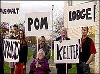 People with banners with words