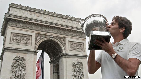 Roger Federer poses with the French Open trophy