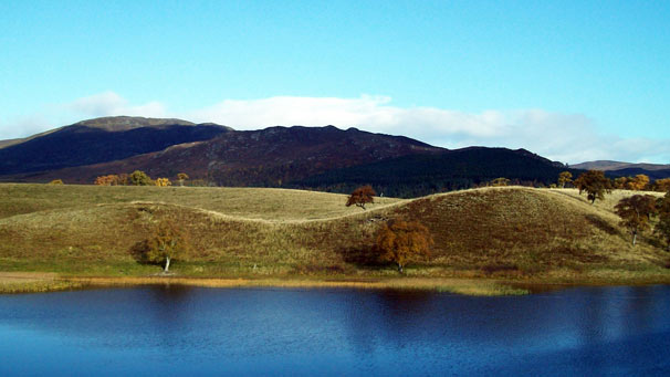 A loch and rolling hills