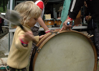 Girl bangs the drum